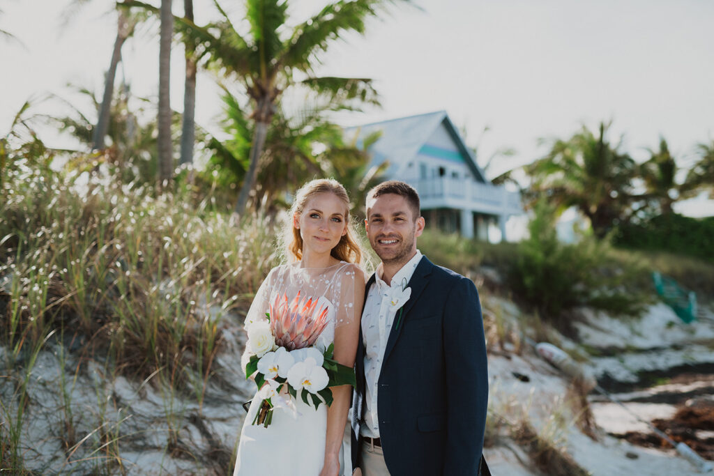 Bahamas Wedding Planner - Blue Sapphire Events for a destination wedding shows off the newly married couple at the Abaco Inn.